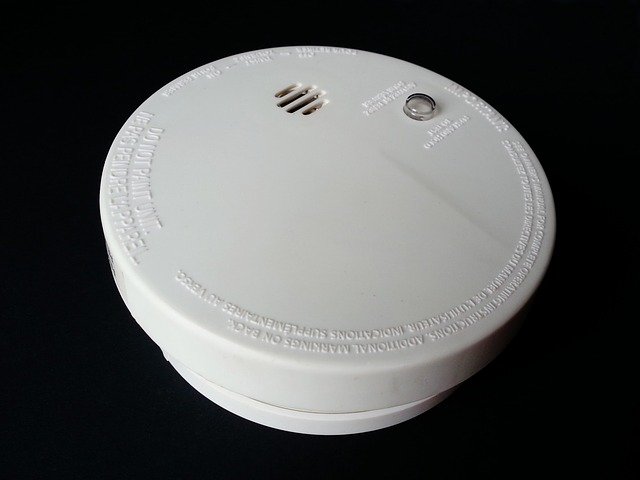 close up of a white smoke detector in rentals