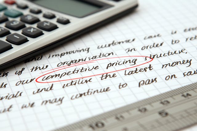 the words competitive pricing circled in red on a piece of paper