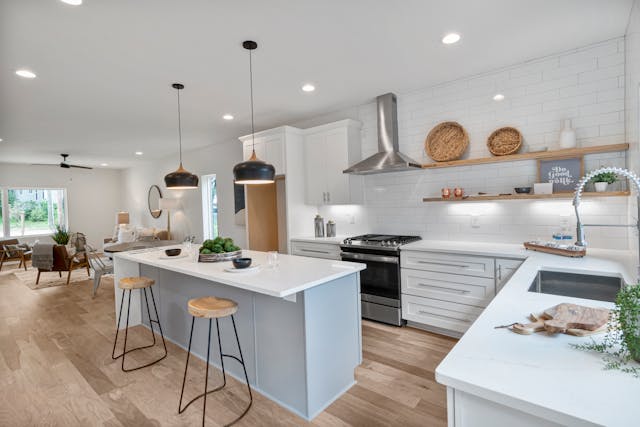 a living room and kitchen with an open floor plan